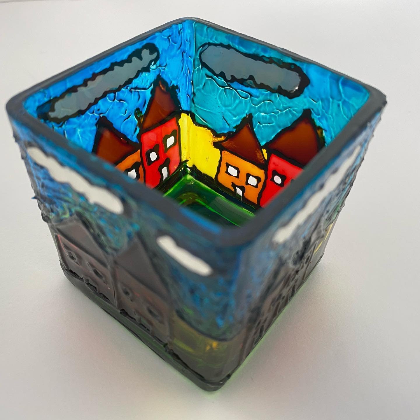 Little village scene painted on a votive